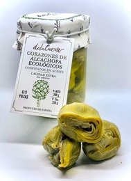 Organic artichoke hearts, confit in oil. Jar contains artichoke hearts preserved in oil, with a natural, earthy appearance.