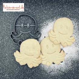 Octopus-shaped baking decoration with a whimsical design, suitable for decorating cakes, cookies, or other baked goods.