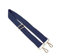A navy blue makeup pouch with a signature strap and metal hardware.