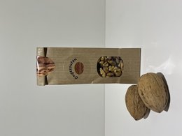 Organic, unprocessed walnuts in a paper bag packaging.