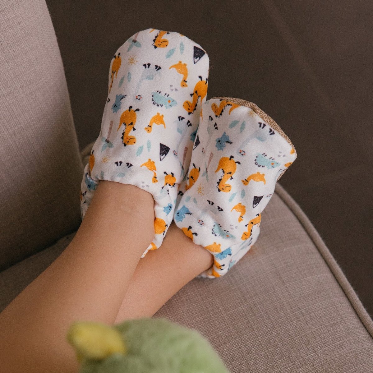 Babyschoenen - gelukkige dino