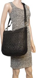 Black shoulder bag for ladies of braided leather - elegant design with both a short and long handle for versatile wearing comfort.