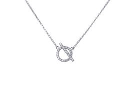 Silver-toned choker necklace with toggle clasp closure and sparkling crystal accents.