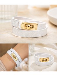 White leather double wrap bracelet with gold buckle clasp, Italian made, minimalist design.