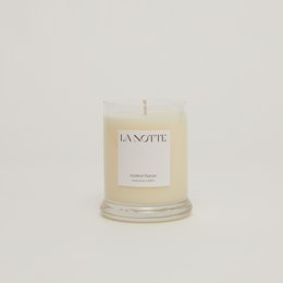 Tall, round white candle with a natural, earthy scent. Made with high-quality ingredients.