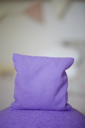 Colorful sensory beanbag filled with cherry pits, suitable for tactile stimulation and sensory play.