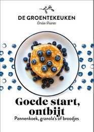 A cookbook featuring a breakfast dish with pancakes, granola, and berries. The image shows a plate with a colorful and appetizing breakfast item.
