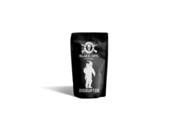 Dark roast coffee beans in a black package with a skull logo.