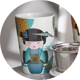 Porcelain mug with a decorative design featuring a Japanese-inspired geisha figure in teal and gold colors.