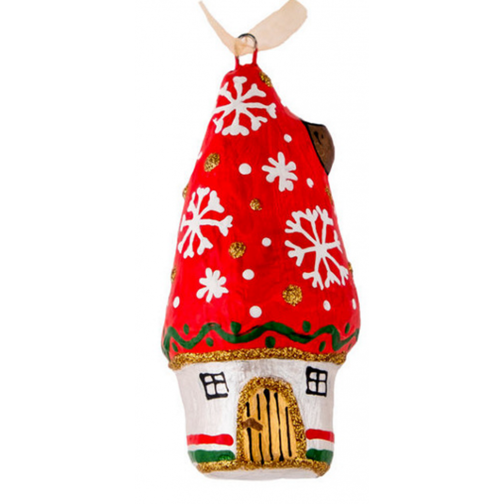 Handmade papier-mache Christmas house with snowflakes