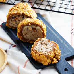 Golden, crunchy gummies filled with a delightful mixture of nuts and spices.