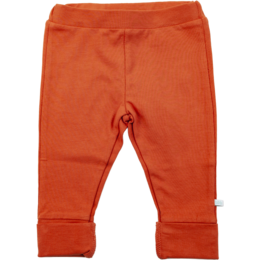 Red baby leggings with polka dot pattern. Soft, stretchy material for comfort and ease of movement.