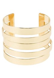 Cuff bracelet made of stacked golden bands with a modern, minimalist design.