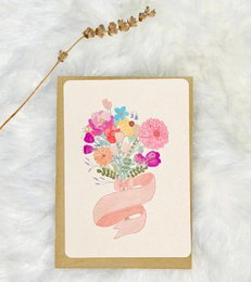 A vibrant bouquet of colorful flowers in a pink vase, featuring a variety of blooms in shades of pink, purple, and blue. The arrangement has a whimsical, artistic style.