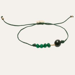 Green bracelet with beads, adjustable cord, and a dark bead accent.