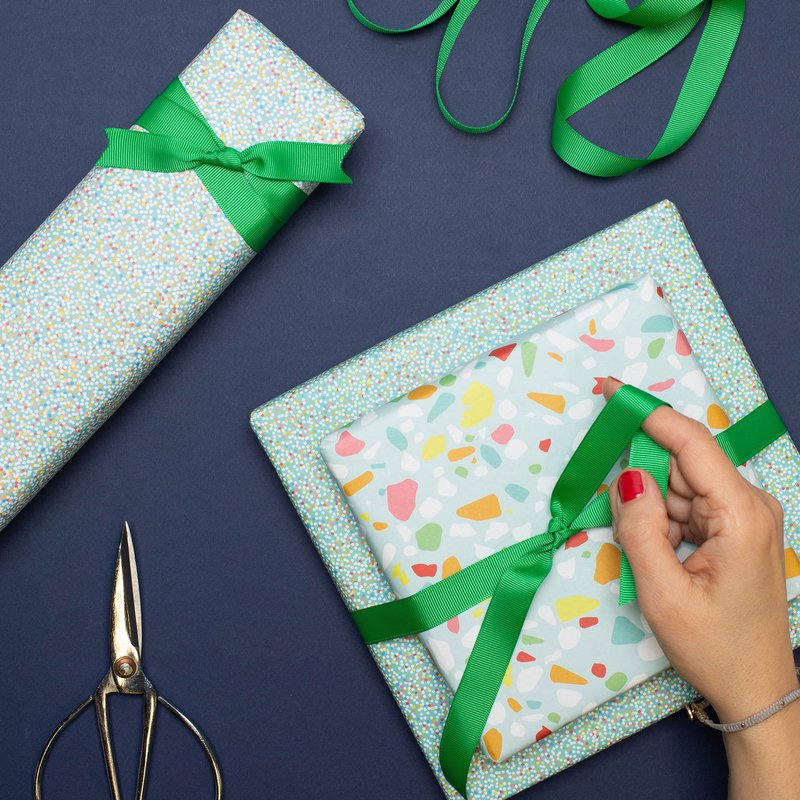 Colorful wrapping paper turquoise with terrazzo pattern, children pack gifts for children's birthday, for school or at birth