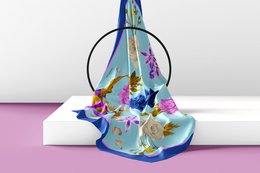  100% silk scarf with floral print in sky blue, blue, and green color variants.