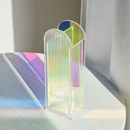 Iridescent acrylic vase with a bohemian arch design and luminous reflections by Pavao Studio. Tall, cylindrical shape with multicolored, translucent panels.