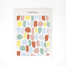Vinilo Manchas is a multicolored, pastel-toned wallpaper with an abstract, organic pattern suitable for a kids' room. The design features a variety of shapes and colors including blue, mint, pink, and sunset hues, creating a playful and whimsical aesthetic.