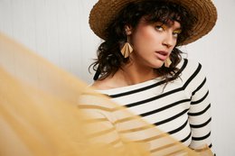 Gold drop earrings with a geometric, origami-inspired design.