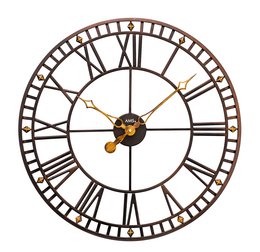 A large round metal wall clock with a classic vintage design featuring Roman numeral hour markers and a prominent central gear mechanism.