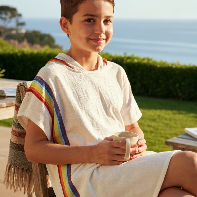 Children's poncho made from 100% cotton with a rainbow design