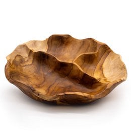 A natural, wooden fruit bowl with an organic, irregular shape and warm, earthy tones. The bowl appears to be made from a single piece of carved wood, showcasing the unique grain and texture of the material.