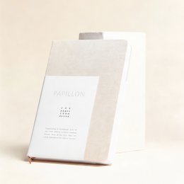 A5 hardcover notebook with blank pages, made of linen material in a cream color with a gold foil number 7 design on the cover.