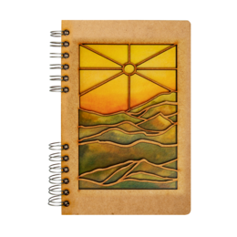 Wooden spiral notebook with sunset landscape design, recycled paper, natural eco-friendly aesthetic.