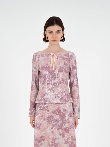 Top met sterrenprint en pailletten