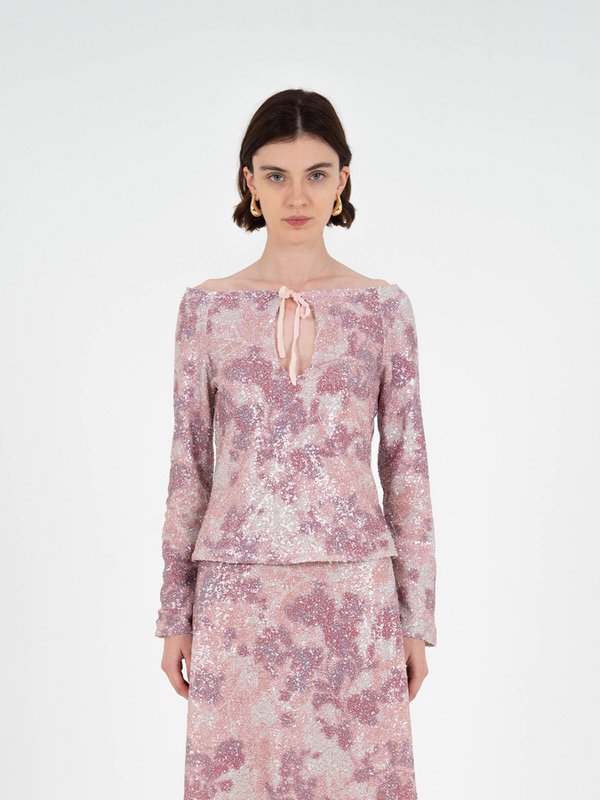 Top met sterrenprint en pailletten