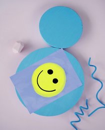 Colorful postcard with a cheerful smiley face design, suitable for friendship and greeting cards.