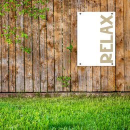  Relax garden poster with "Wild Wonder" text and wooden background with grass.