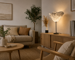 Tall, round table lamp with a textured, off-white glass shade.