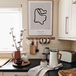 Wall art featuring a minimalist illustration of Amsterdam. Available in various sizes from A4 to 50x70 cm. Suitable for home or office decor.