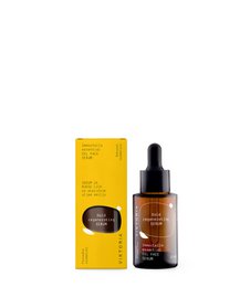 Gold regenerating serum in a glass bottle with dropper. Serum is a clear liquid with a yellow tint. The bottle is packaged in a yellow box.