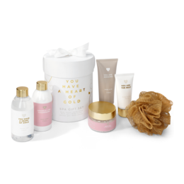  A spa gift set containing a variety of beauty products, including a pink bottle, a white jar, and a gold-colored bottle. The set appears to be designed for relaxation and pampering.