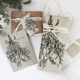 Gift tags made from grass paper, mistletoe