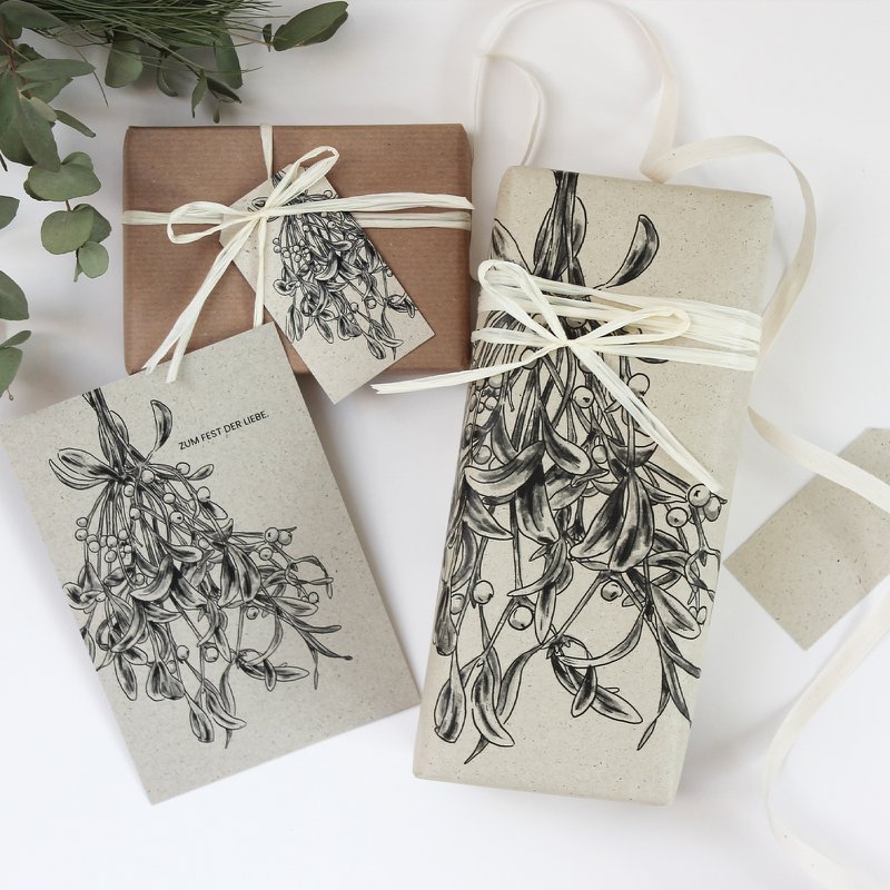 Gift tags made from grass paper, mistletoe