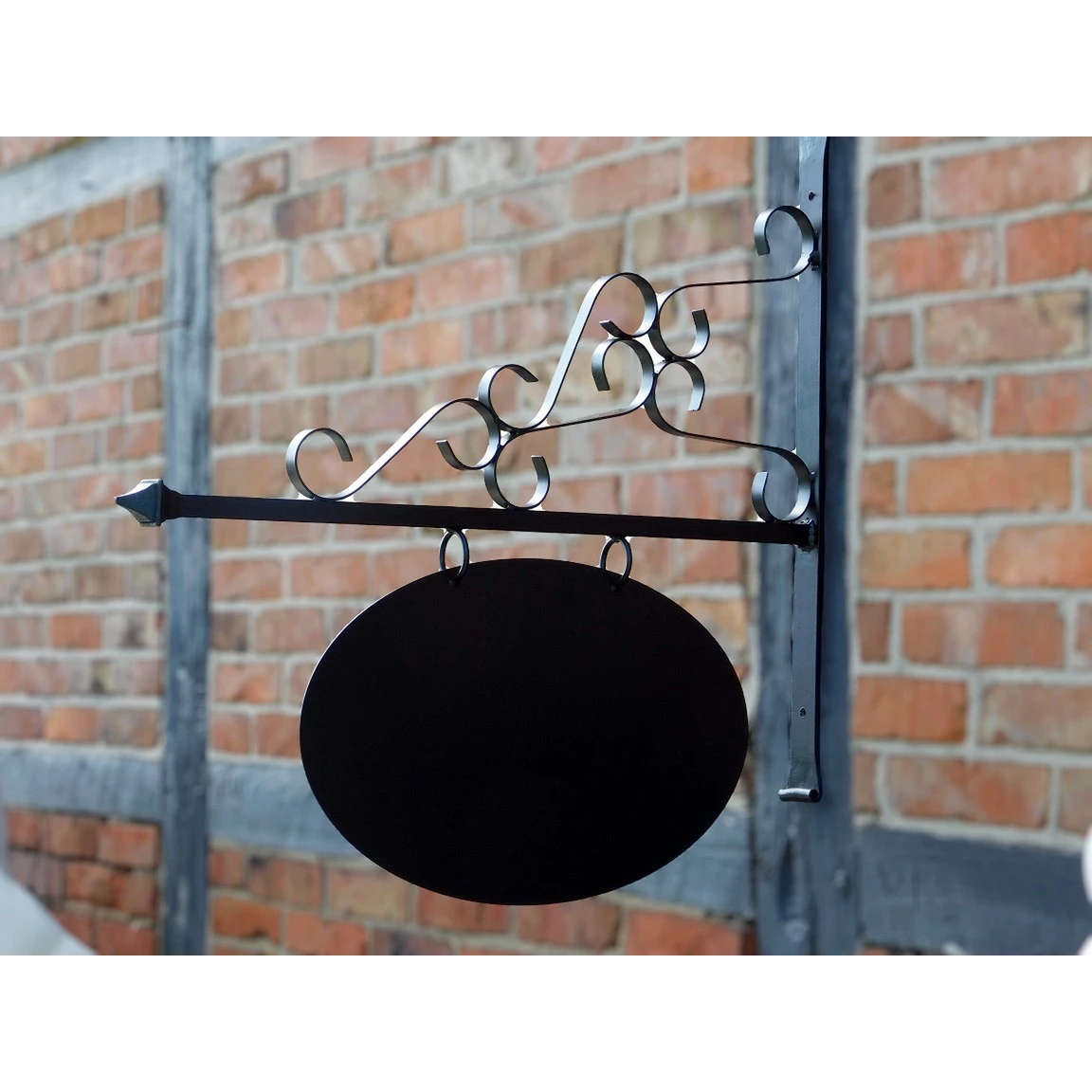 Iron shop sign – black powder-coated – romantic – oval wall-mounted model