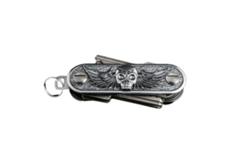 A compact, multi-functional key organizer with a swing-out arm design featuring a skull motif.