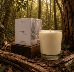 Cream colored tall cylindrical candle, glass container, wooden base, sandalwood scent, minimalist design, luxury packaging.