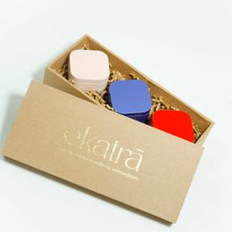 Colorful scented tealights set: cream, blue, red, yellow, black. Square rounded shape candles gift box.