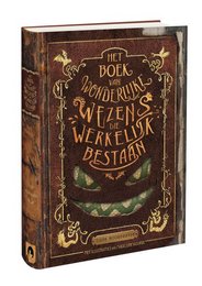 A hardcover book titled "The Book of Wondrous Creatures That Actually Exist" with an ornate, vintage-style cover featuring illustrations of fantastical creatures. The book appears to be a children's reading book focused on the natural world and its wonders.