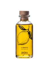 Organic olive oil dressing with lemon flavor, packaged in a 100 ml glass bottle with a cork cap. The bottle features a graphic design of a lemon.