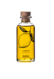 Organic olive oil dressing with lemon flavor, packaged in a 100 ml glass bottle with a cork cap. The bottle features a graphic design of a lemon.