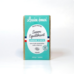 A natural, handmade soap bar with nourishing nettle extract. The soap is packaged in a turquoise box with the brand name "Louise Émoi" prominently displayed.