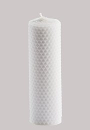 A tall, gray pillar candle with a textured diamond pattern design.