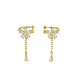 Elegant gold-tone ear cuffs with delicate floral design and dangling crystal accents. Suitable for formal or casual wear.