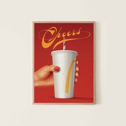 A retro-style poster featuring a hand holding a tall, white beverage cup with a straw. The background is a vibrant red with the word "Cheers" prominently displayed.